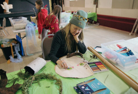 Artist, Kathryn Cooke, volunteers her time at the Playhouse Workshops